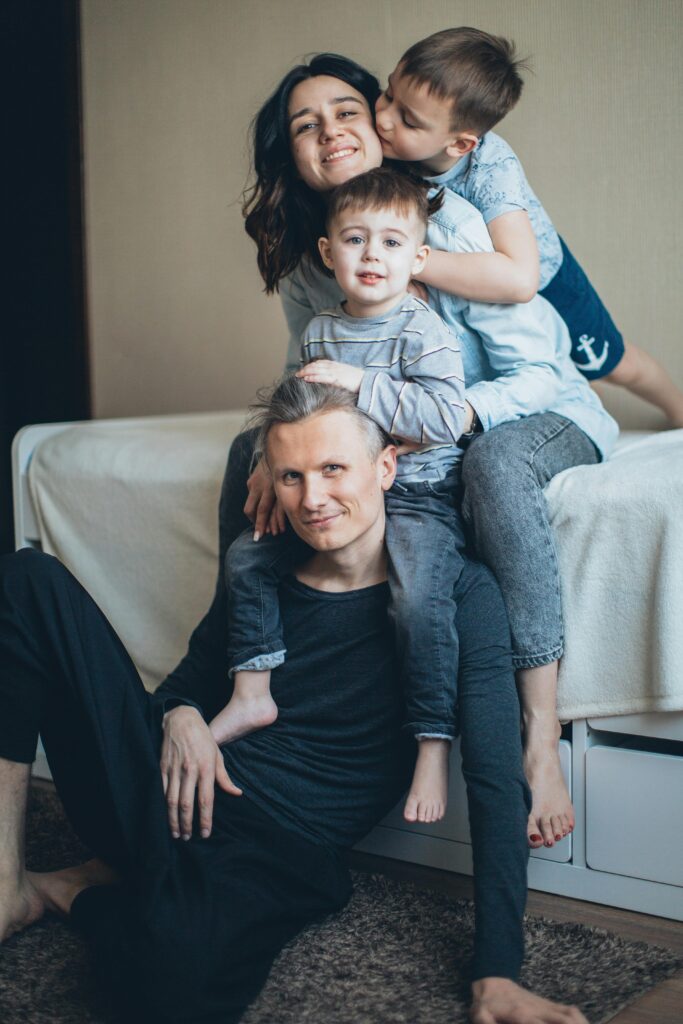 pexels photo 4008824 4008824 A joyful family bonding in a cozy indoor setting, capturing love and togetherness.